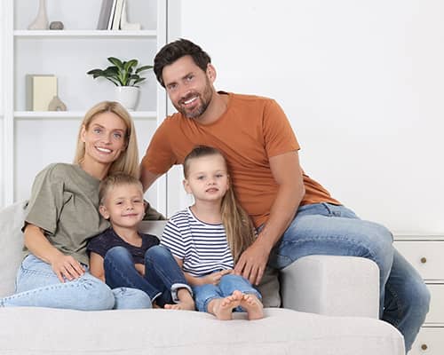 Happy family with children in their new home in Massachusetts
